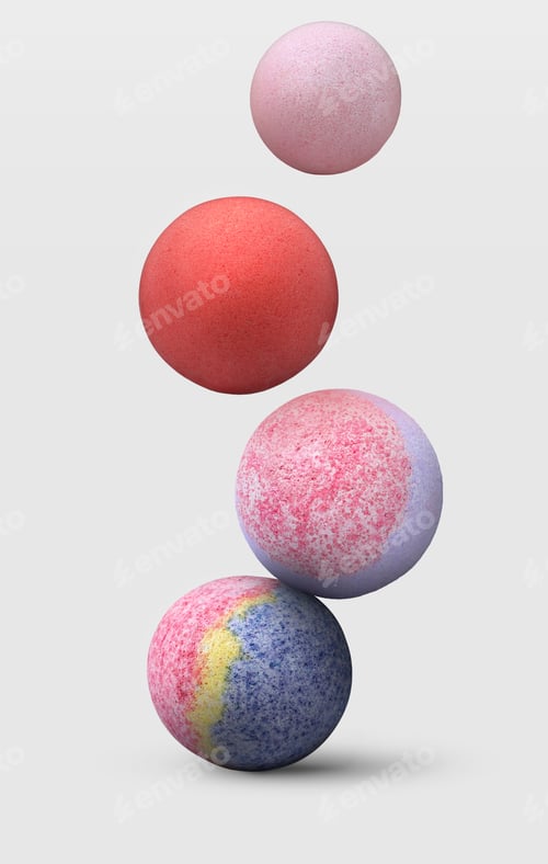 Preview: Many different bath bombs falling on white background