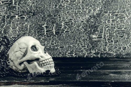 Preview: Halloween human skull on an old wooden table