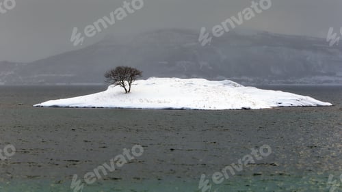 Preview: Aerial view of a snowy island on the sea in Lofotens, Norway