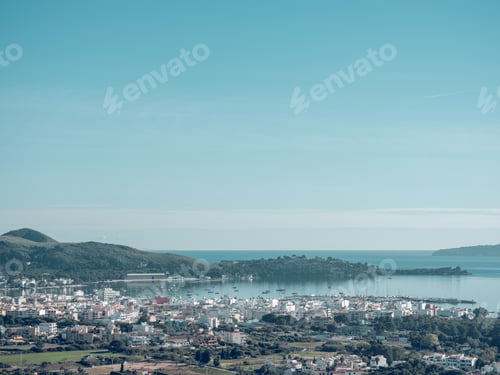 Preview: Town and hills on coast of sea
