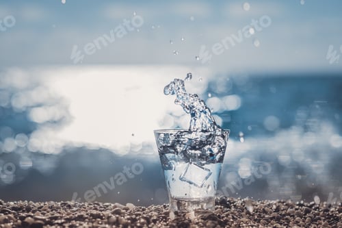 Preview: splashing water in a glass by the sea