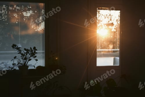 Preview: Closeup shot of the sunset sun rays coming through the door window