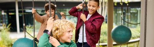 Preview: Joyful childhood adventures in autumn leaves at the playground with friends