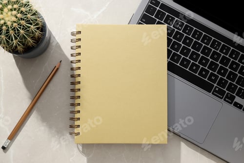 Preview: Notebooks lie near a laptop on a light background