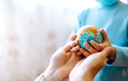 Preview: Child in protective sterile medical mask with mother holding a world globe. Save planet.