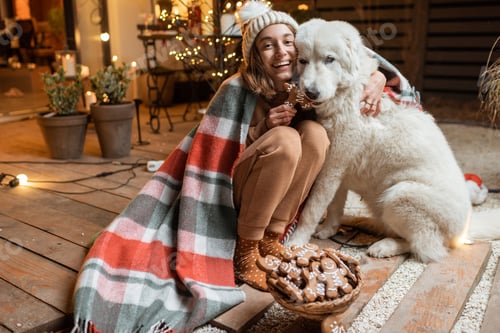 Preview: Woman celebrating with dog a New Year holidays at home