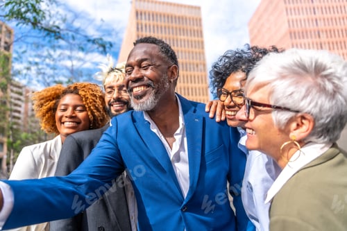 Preview: Mature african businessman taking a selfie with colleagues outdoors