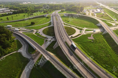 Preview: Cars moving on transport road junction in city, aerial view