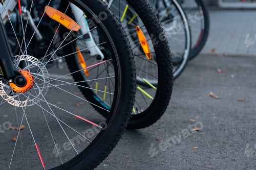 Preview: close-up view of bicycle wheels with tyres on street