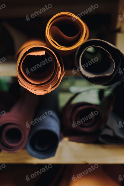 Preview: Rolls of cloth lie on market shelves. fabric on manufacture