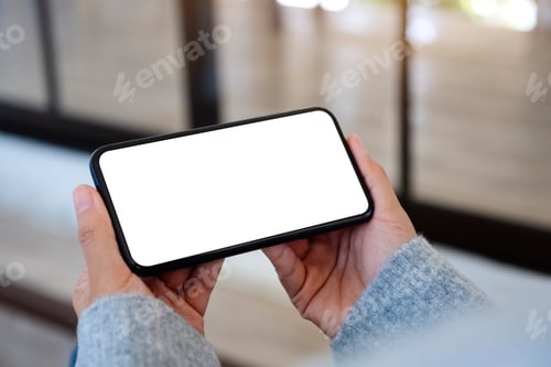 Preview: Mockup image of a woman holding mobile phone with blank white desktop screen