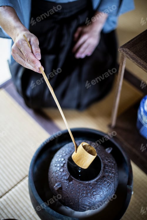 Preview: Traditional Japanese Tea Ceremony, man using a Hishaku, a bamboo ladle in water