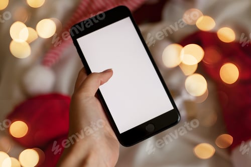 Preview: person holding mobile phone - mockup friendly photo - christmas shopping for gifts