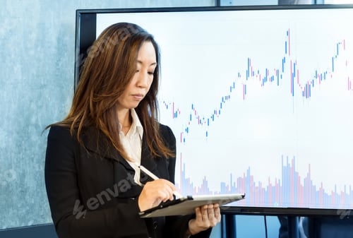 Preview: Chinese businesswoman working on device