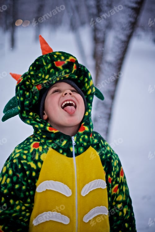 Preview: Happy young child in the green dragon costume