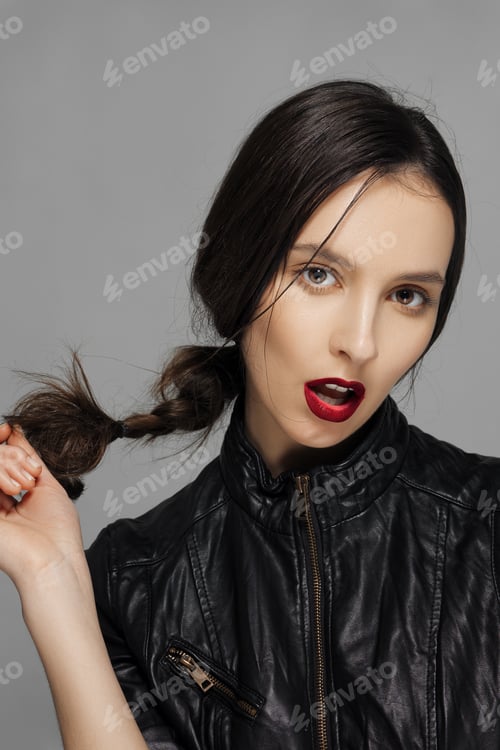 Preview: Woman Wearing Stylish Leather Jacket with Braided Hair