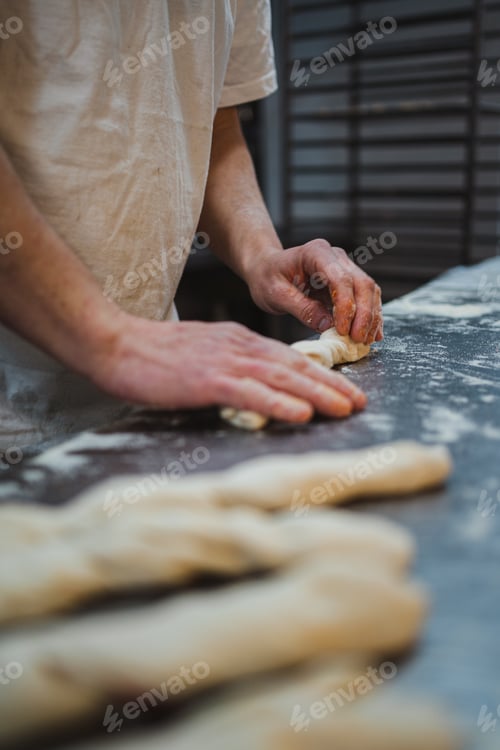 Preview: Baker rolling up stuffed bread sticks