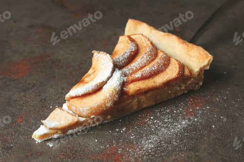 Preview: Cake spoon with slice of apple pie on textured background