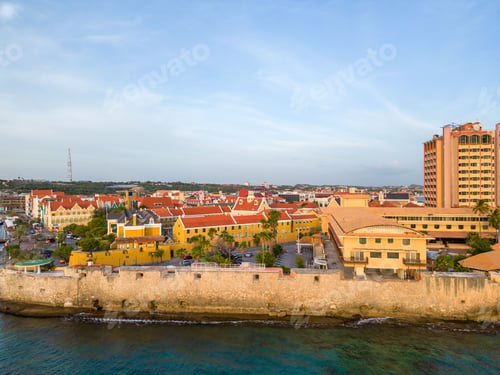 Preview: Willemstad city and the ocean during the sunset under a blue sky