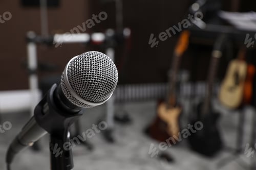 Preview: Modern microphone at recording studio, space for text. Music band practice