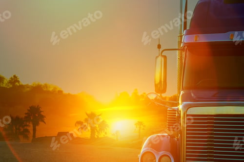 Preview: Truck dashboard on the countryside road in motion against with sunset