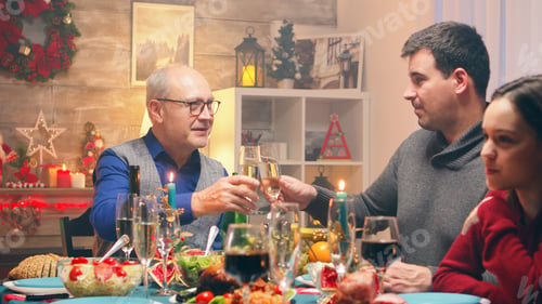 Preview: Zoom in shot of grandfather at family reunion