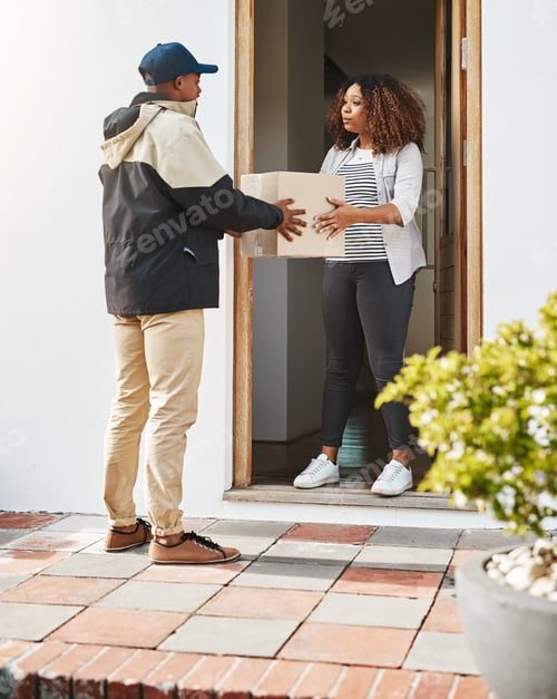 Preview: Shot of a courier making a delivery to a customer at her home