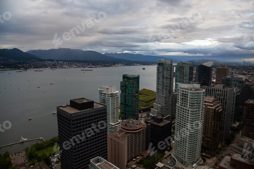 Preview: Aerial view of Downtown City during a stormy summer sunset