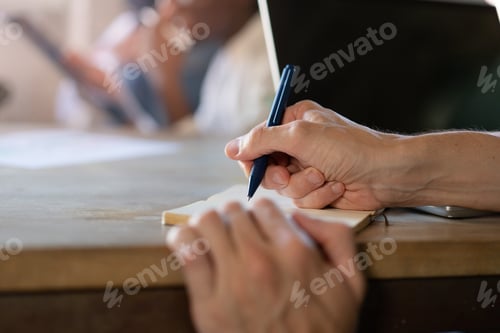 Preview: Female Hand Taking Notes in an Office