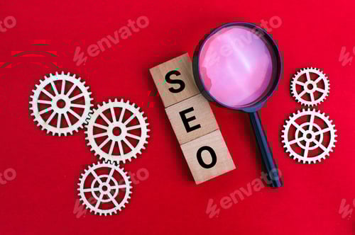 Preview: magnifying glass and gear teeth with the letters SEO or the word Search Engine Optimization