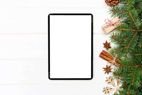 Preview: Digital tablet mock up with rustic Christmas wooden background decorations