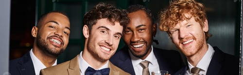 Preview: bachelor party banner, portrait of happy multiethnic best men and groom in looking at camera