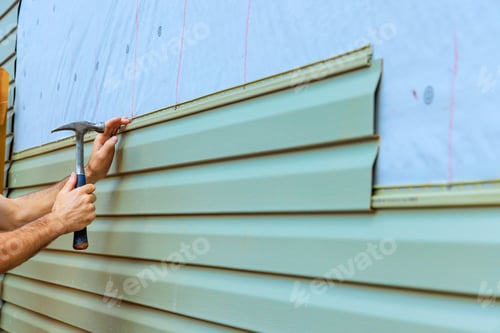 Preview: Home improvement project involves installing new siding on an exterior wall with a focus on detail