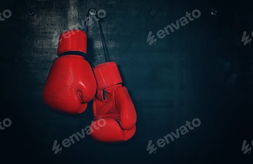 Preview: Red leather boxing gloves hanging on black wall