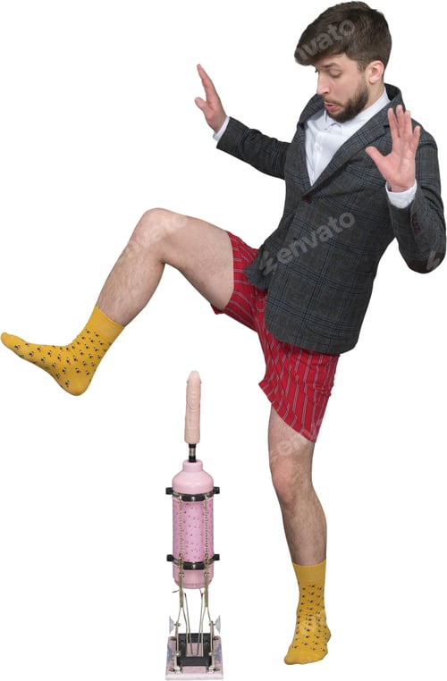 Preview: a man in a suit and yellow socks jumping over a blender