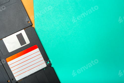 Preview: Old computer floppy disks on a green and brown background