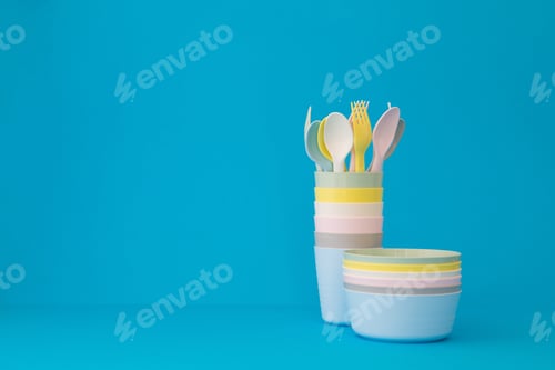 Preview: Plastic pastel tableware blue background copy space
