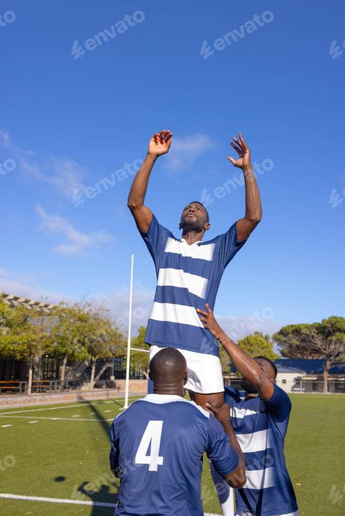 Preview: Three African American young male athletes training on a sunny day