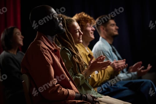 Preview: Group of Diverse Young Adults Applauding at Event