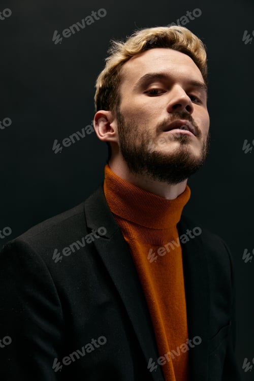 Preview: man with beard and hairstyle orange sweater jacket model black background
