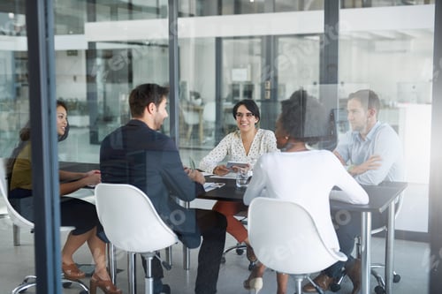 Preview: In the boardroom. Cropped shot of a group of businesspeople meeting in the boardroom.