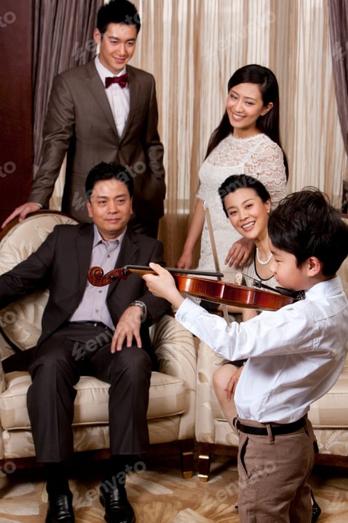 Preview: Little boy playing violin in front of family members