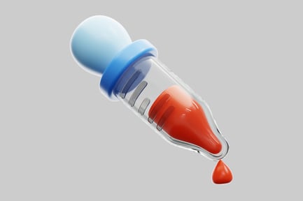 Vista previa: Jeringa con líquido rojo y gotita