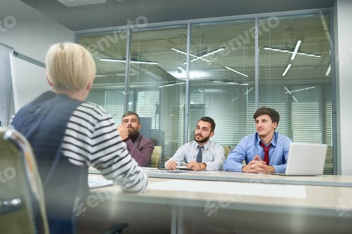 Preview: Business People Discussing Work Plan in Office
