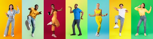 Preview: Group of happy carefree multiethnic people posing on colorful studio backgrounds