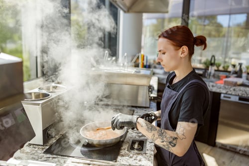 Preview: A talented chef skillfully cooking in a modern kitchen environment with great passion and artistry