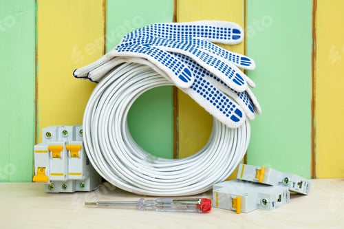 Preview: coil wires, circuit breakers and tools near the wall