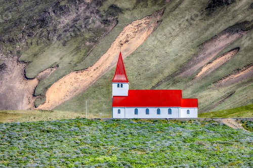 Preview: Impressive view of Vikurkirkja christian church in front of mouintain