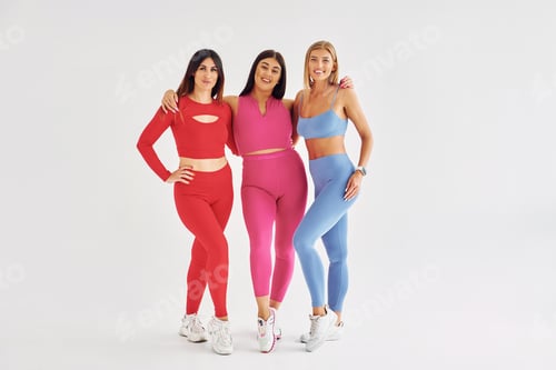 Preview: Positive mood. Beautiful women in sportive clothes is indoors in the studio