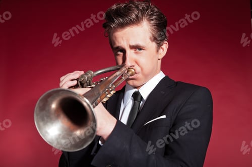 Preview: Retro Fifties Trumpet Player Wearing Black Suit. Playing Trumpet. Red Wall.